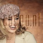 25-01-2005 Antje Monteiro at studio in Amsterdam, January 25, 2005.

[keywords]Posed, Headshot, Smiling, Cap[/keywords]